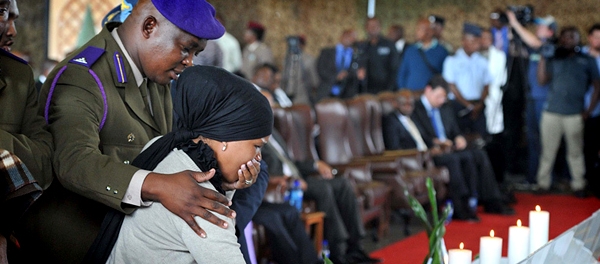 Image: Family members light candles of remembrance at the memorial service of soldiers who lost their lives in the Central African Republic deployment. Photo © GCIS