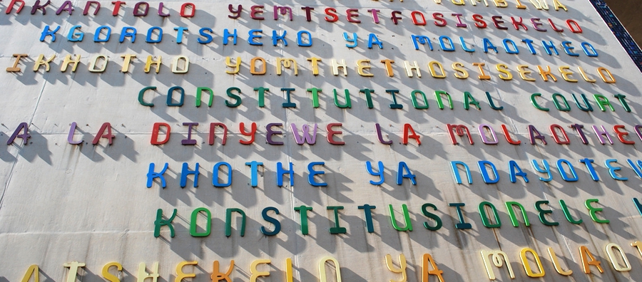 The exterior of the Constitutional Court, giving its name in the 11 official languages of South Africa. Photo © Erich/ Flickr