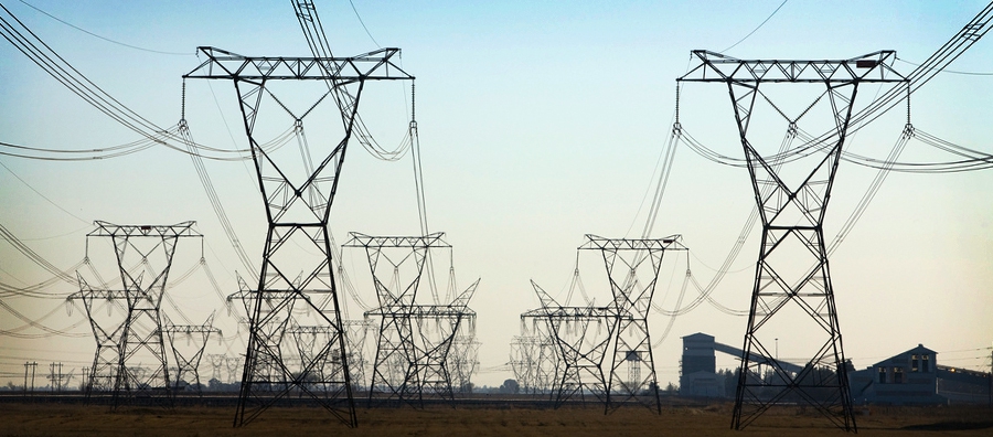 Electricity lines running out of the Lethaba Power Station. Despite South Africa’s commitment to renewable energy, a bulk of the country’s energy comes from coal-powered stations like this one, which according to the Eskom website consume an average of 50 000 tons of fuel per day. Photo © World Bank/ John Hogg